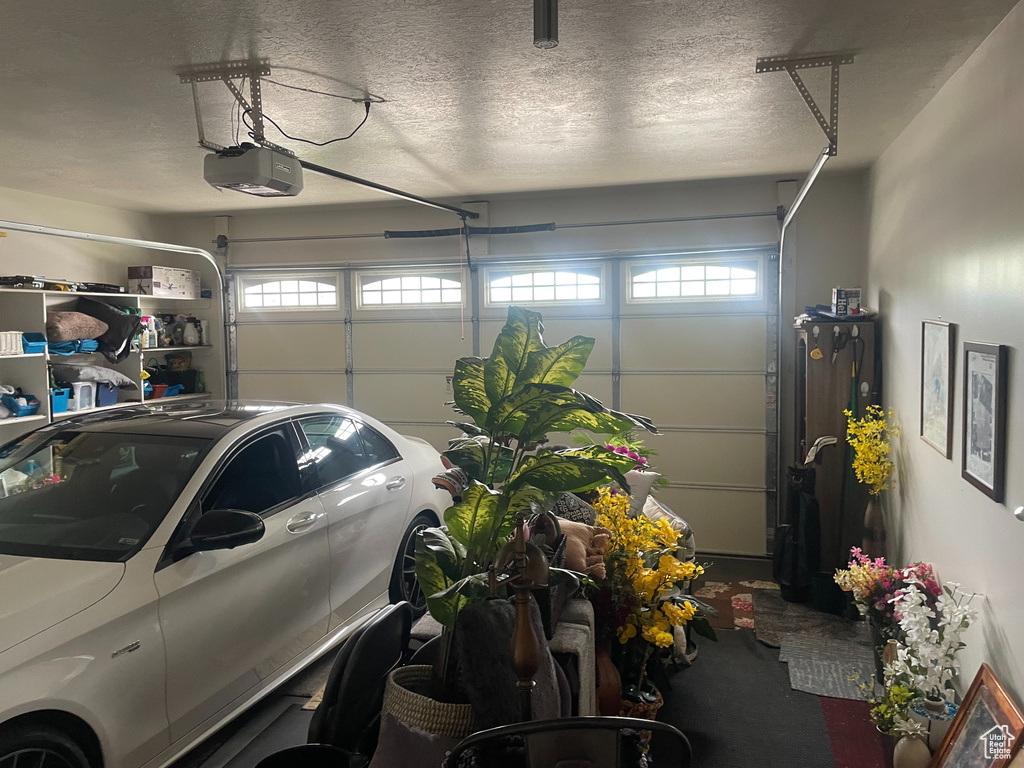 Garage featuring a garage door opener