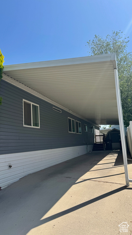 View of home's exterior featuring an attached carport