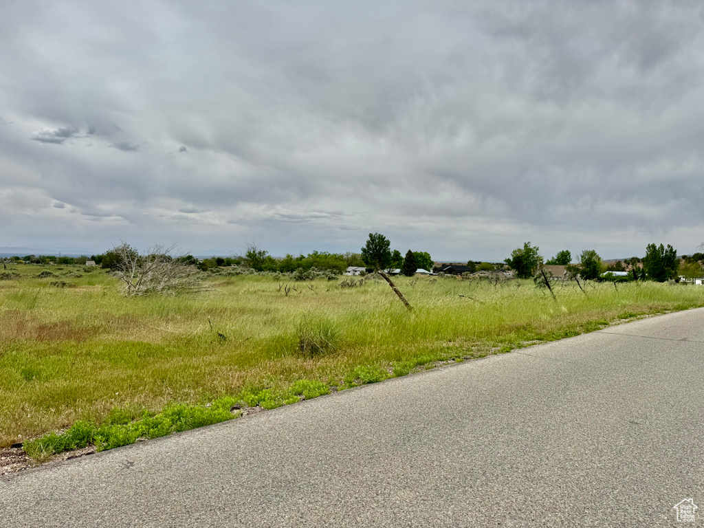 View of asphalt road with a view of countryside