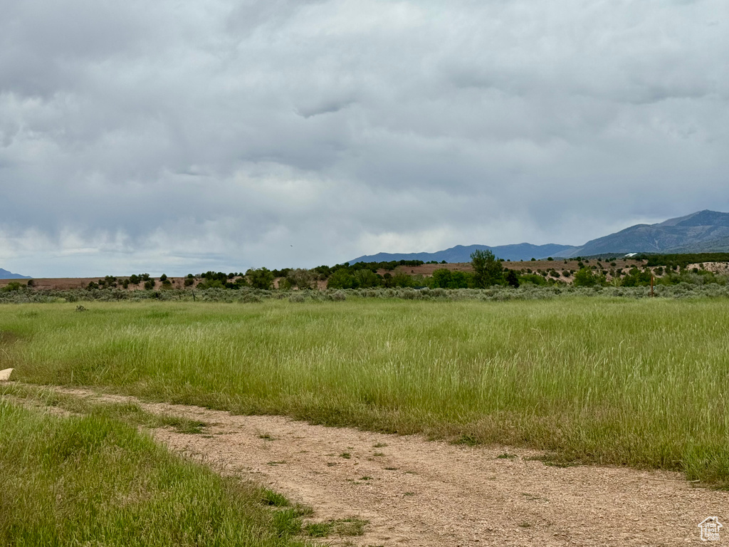 View of mountain backdrop featuring rural landscape