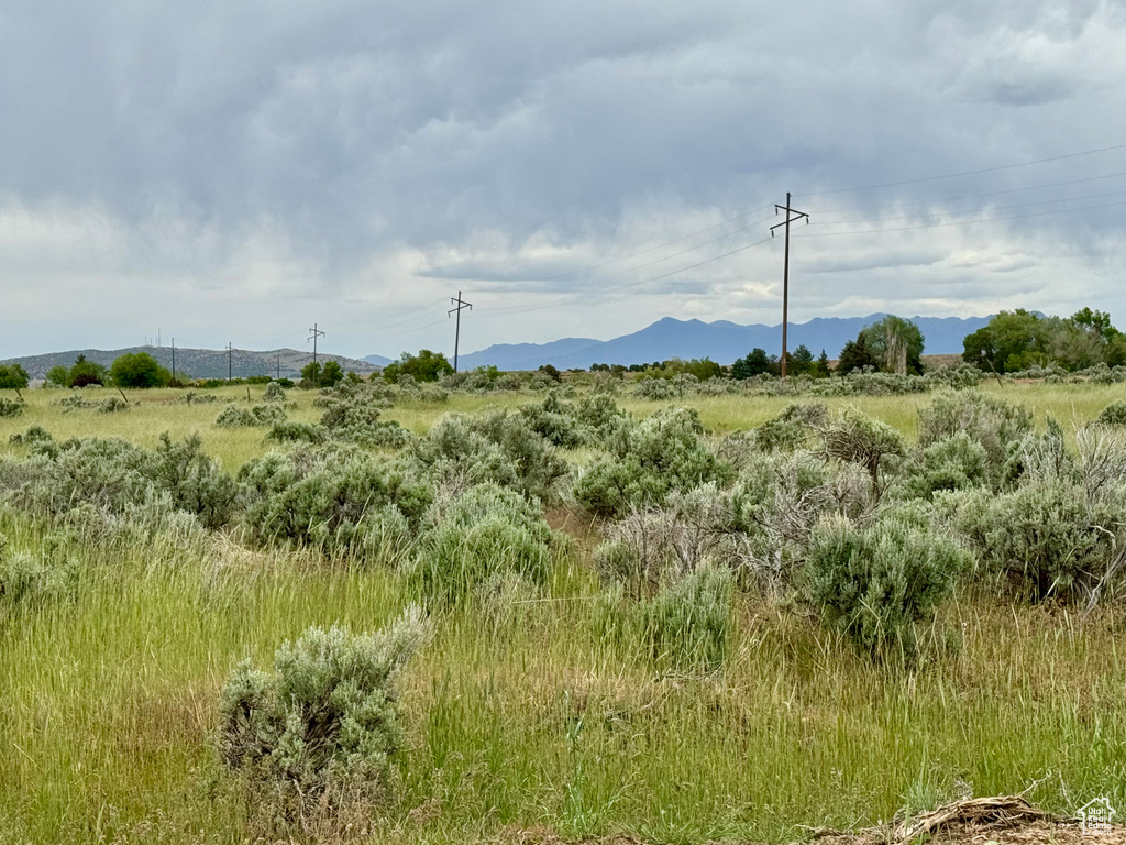 View of mountain backdrop featuring rural landscape