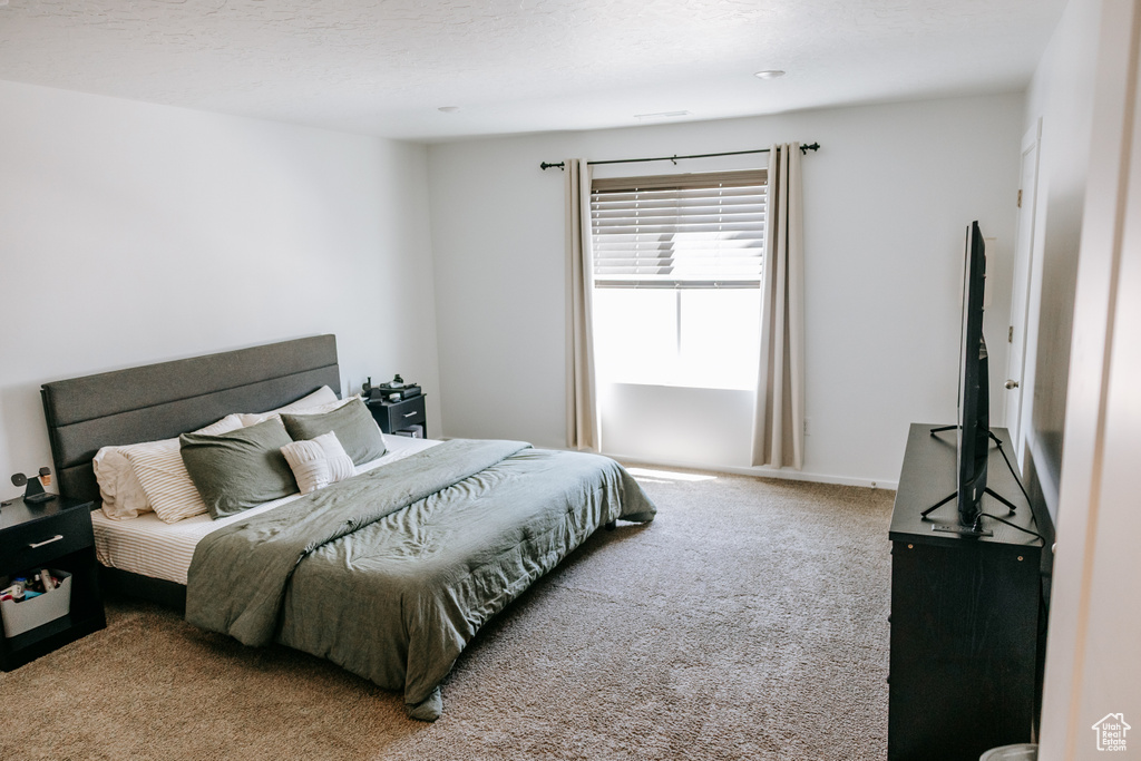 Bedroom with carpet