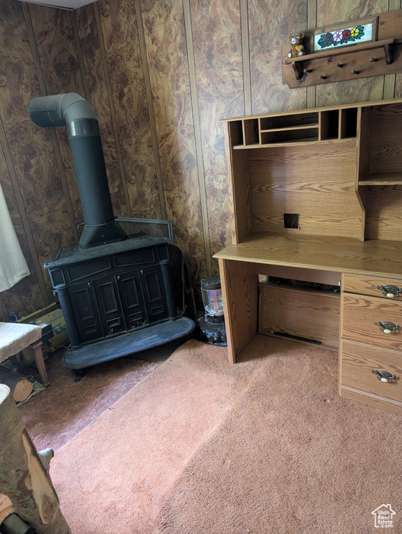 Detailed view of a wood stove and carpet flooring
