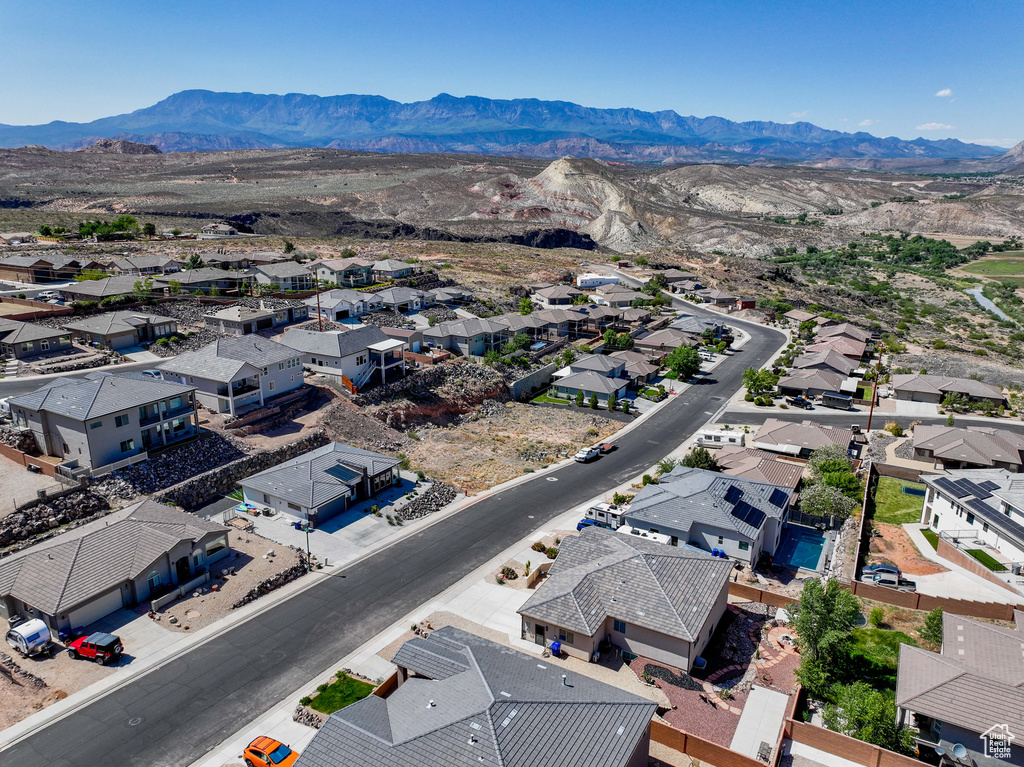 Aerial perspective of suburban area featuring a mountainous background