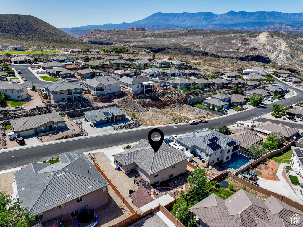 Aerial perspective of suburban area featuring a mountainous background