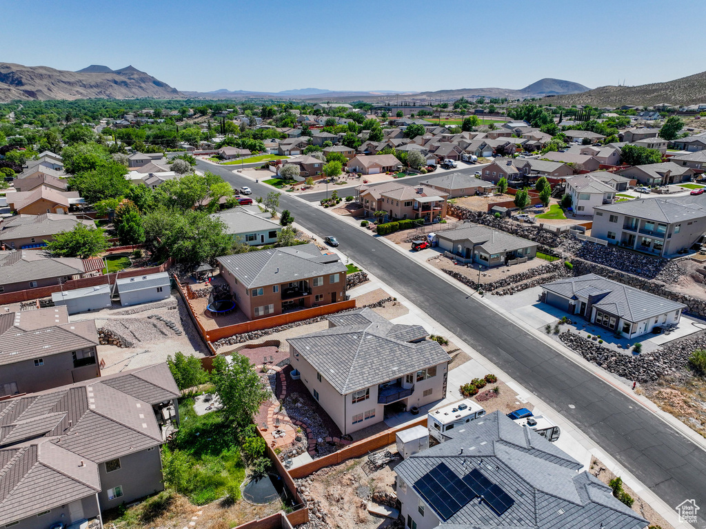 Aerial perspective of suburban area featuring a mountain backdrop