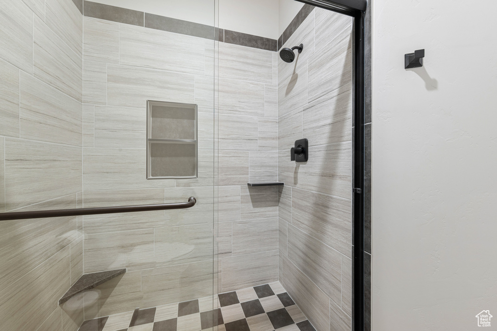 Full bathroom featuring a shower stall