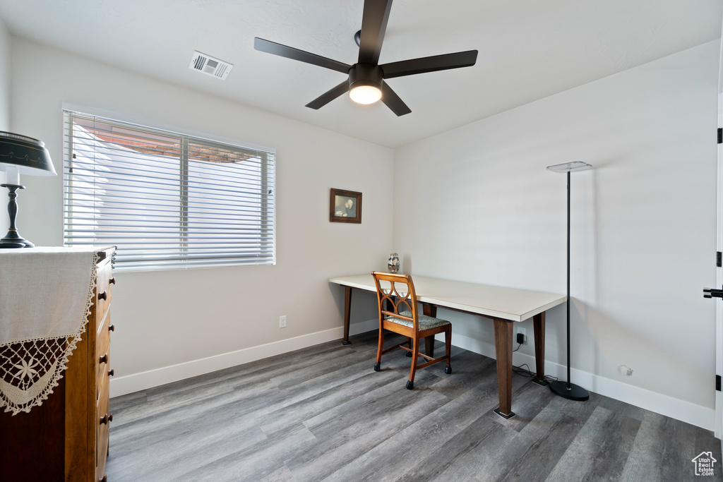 Office with a ceiling fan, wood finished floors, and baseboards
