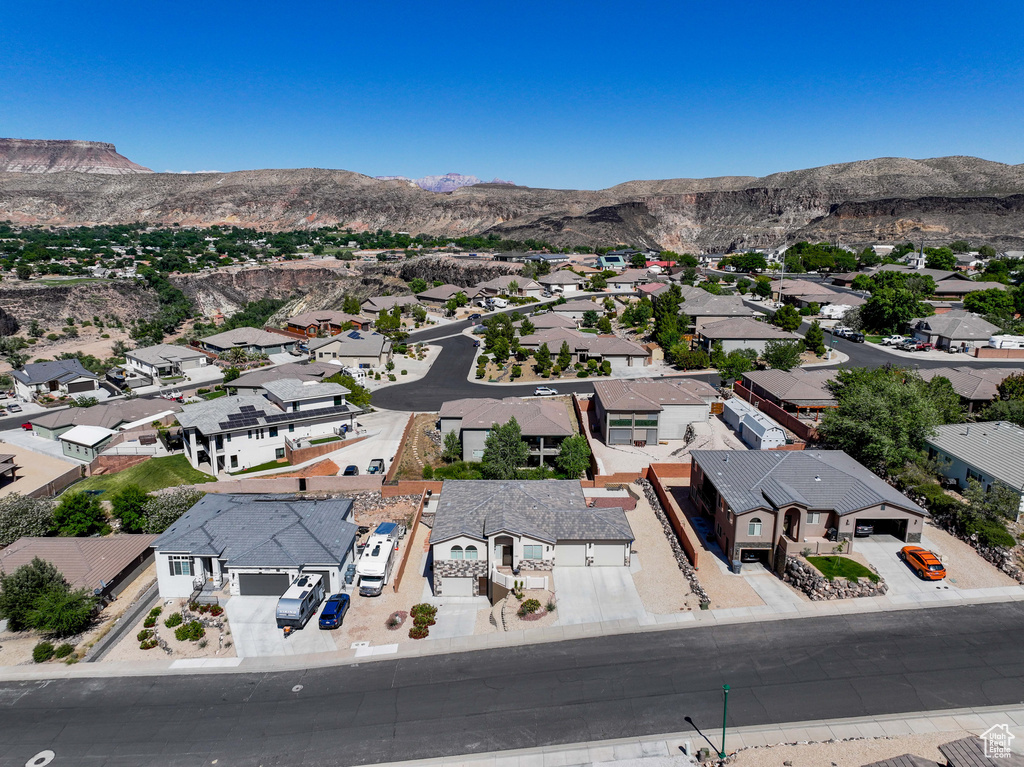 Aerial perspective of suburban area featuring a mountain backdrop