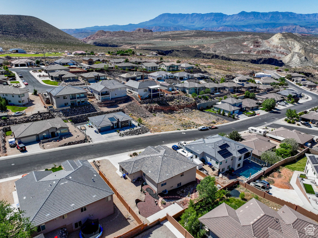 Aerial perspective of suburban area with a mountainous background