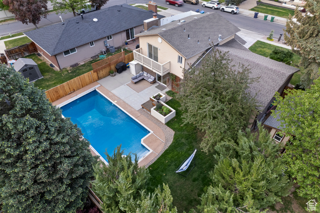 Aerial view of property and surrounding area with a pool