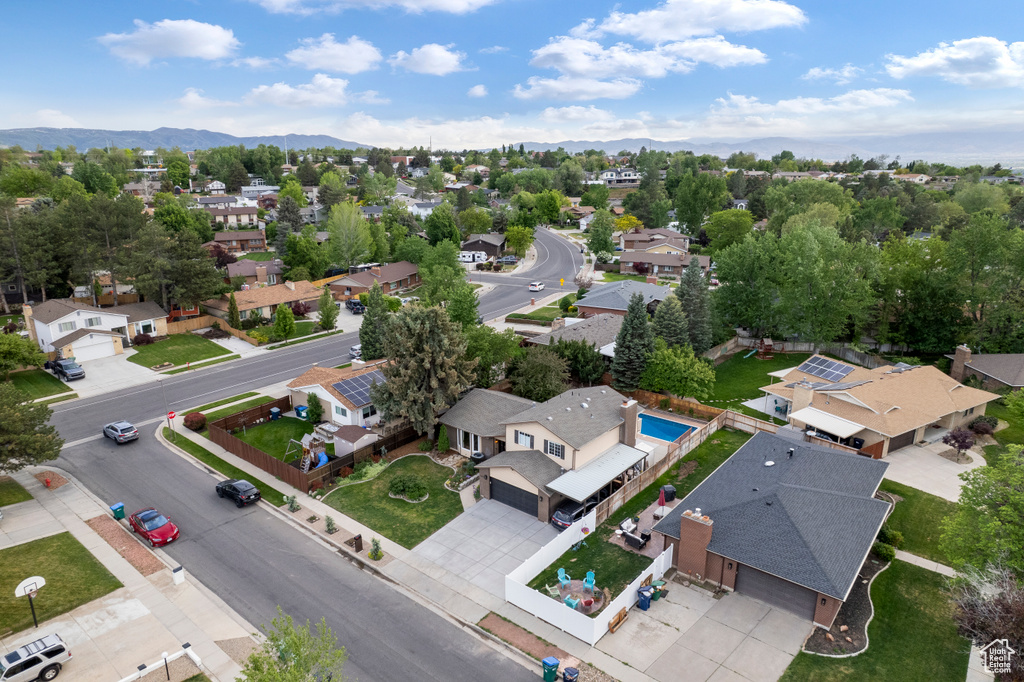 Aerial perspective of suburban area with a mountain backdrop