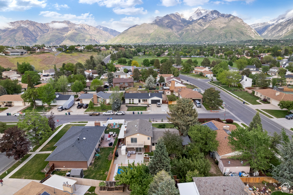 Aerial perspective of suburban area with a mountain backdrop