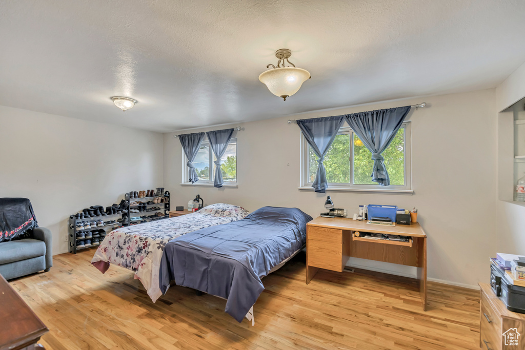 Bedroom with light wood-type flooring
