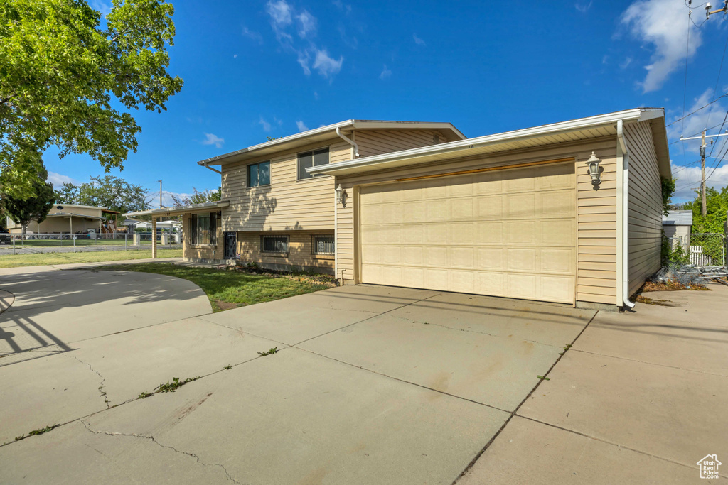 Tri-level home with concrete driveway