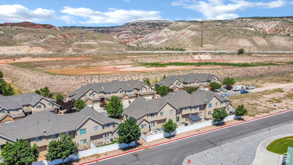 Aerial perspective of suburban area with a mountain backdrop