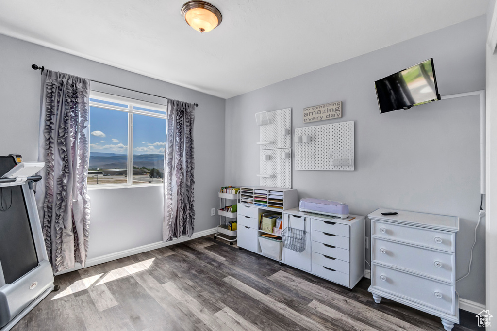 Office featuring wood finished floors and baseboards