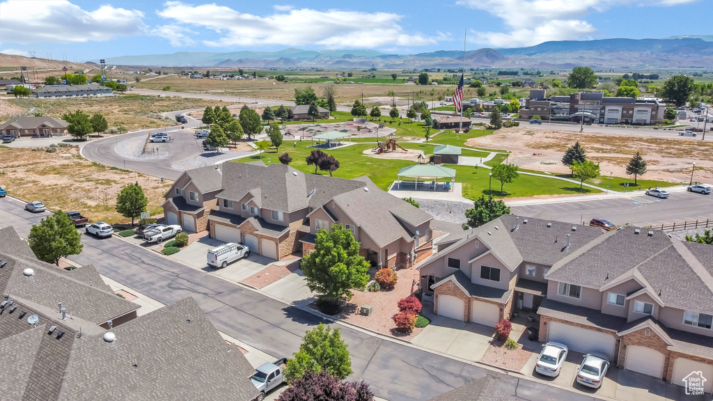 Aerial view of residential area featuring a mountain backdrop