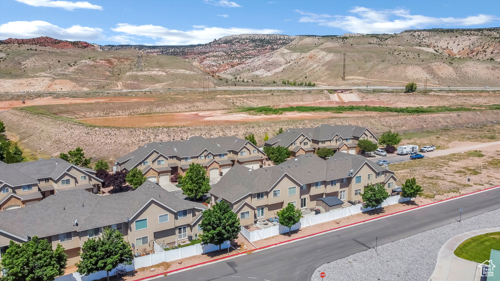 Aerial perspective of suburban area featuring a mountainous background