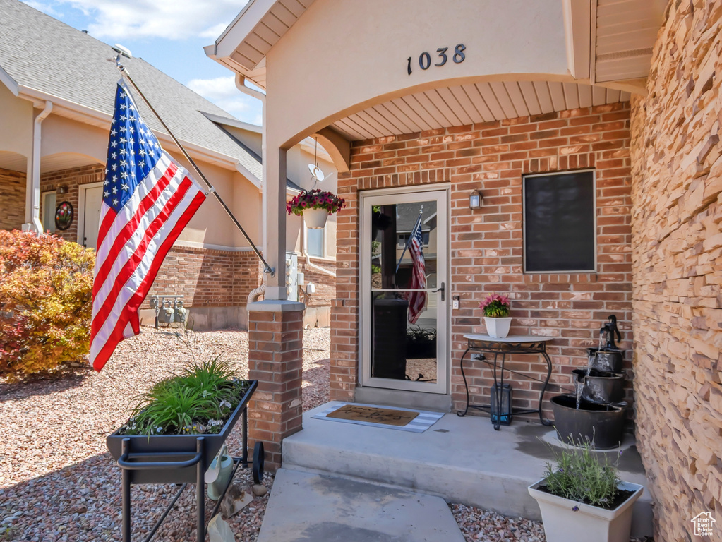 Doorway to property with brick siding