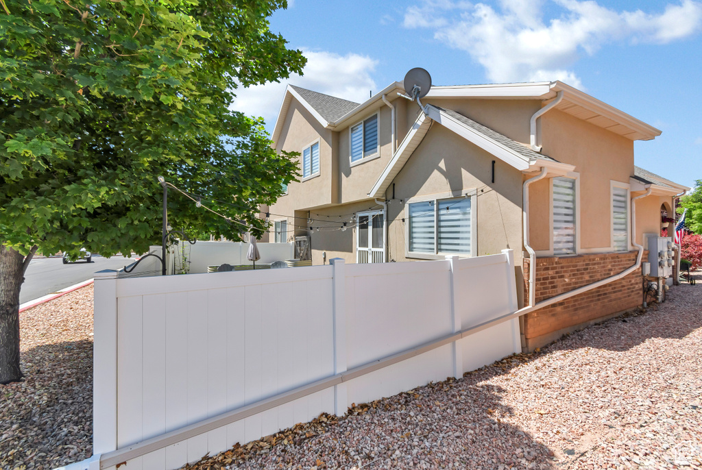 View of home's exterior featuring stucco siding