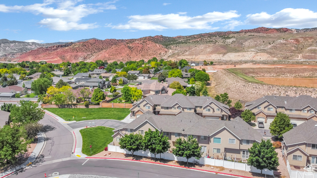 Aerial view of residential area featuring a mountain backdrop