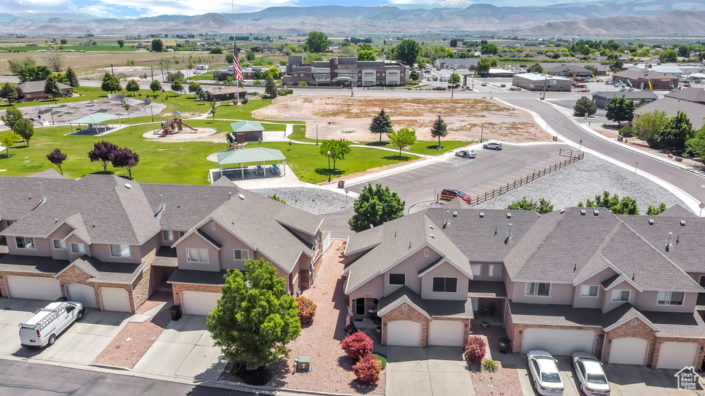 Aerial perspective of suburban area featuring a mountainous background
