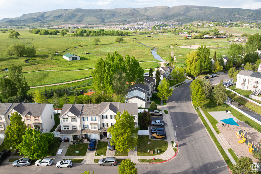 Aerial view of sparsely populated area featuring a mountainous background
