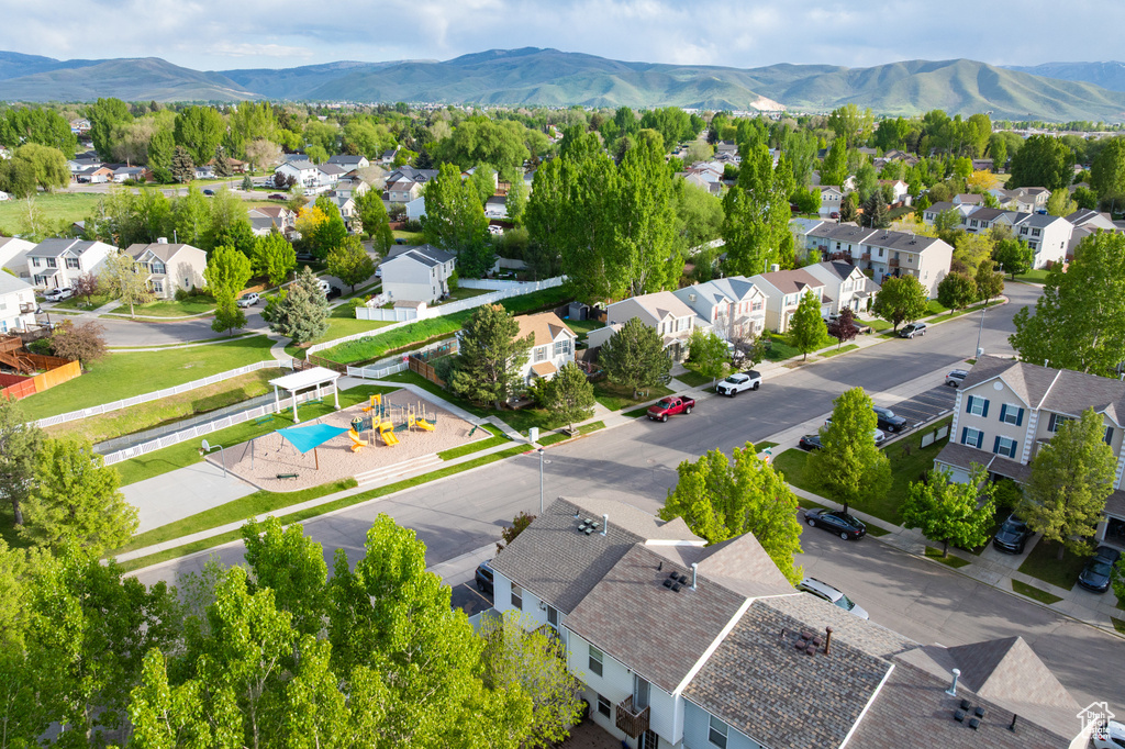 Aerial perspective of suburban area featuring a mountainous background