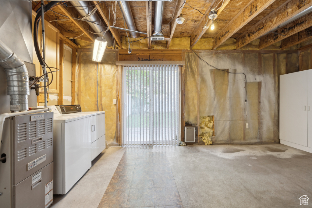 Basement with washer and clothes dryer