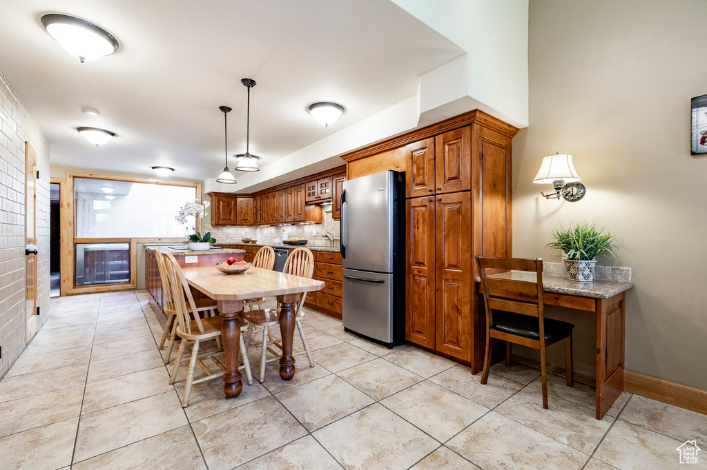 Dining room featuring light tile patterned floors