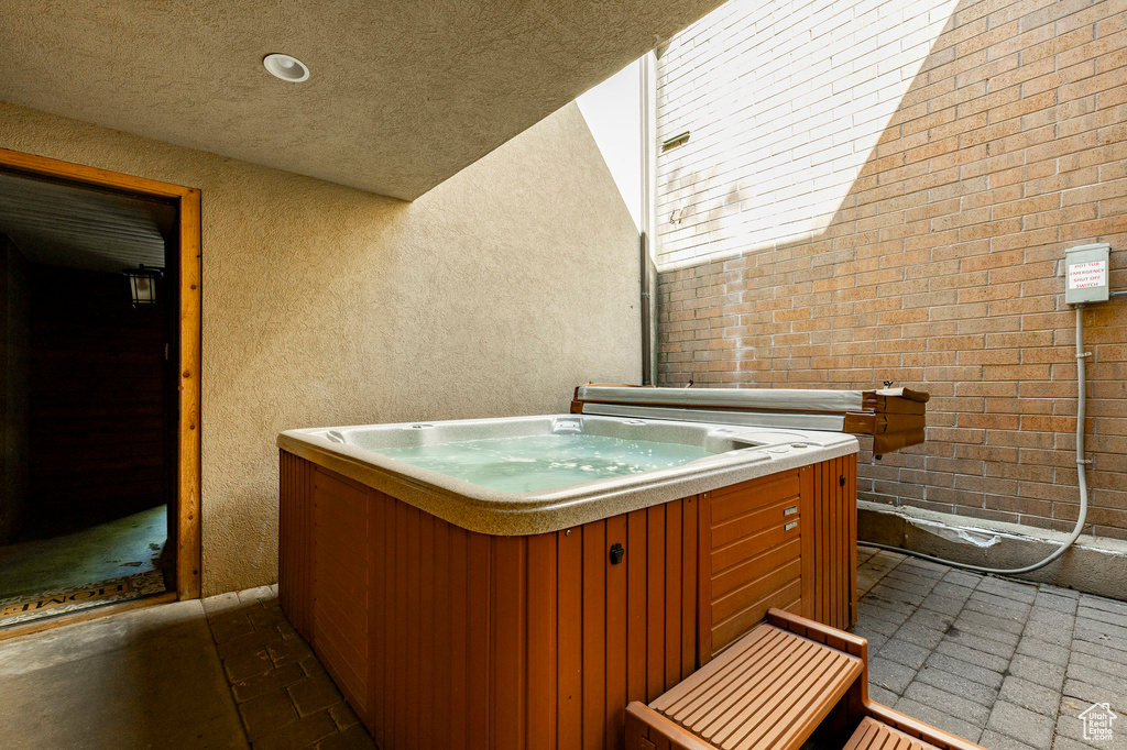 View of patio / terrace with a hot tub