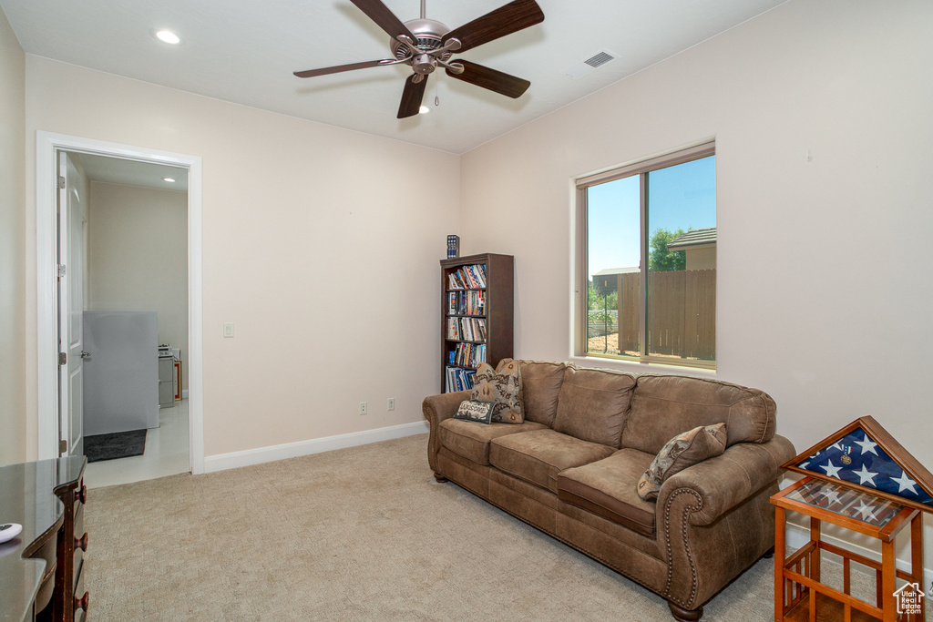 Living room with a ceiling fan, carpet floors, recessed lighting, and baseboards