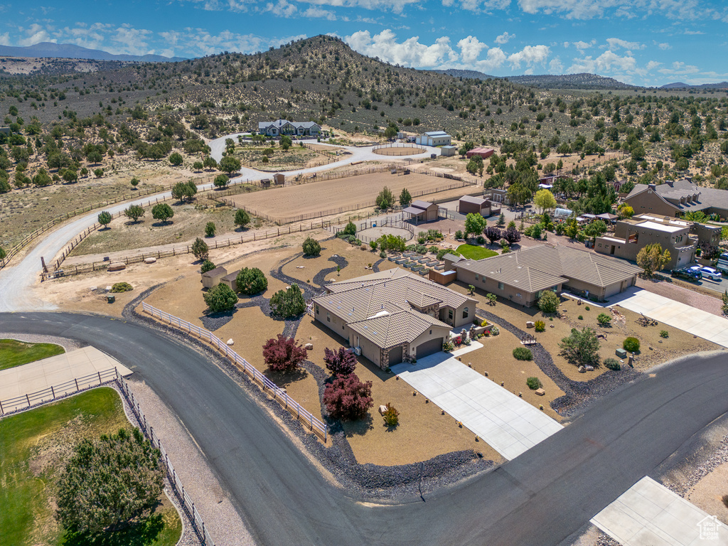 Aerial perspective of suburban area with a mountainous background