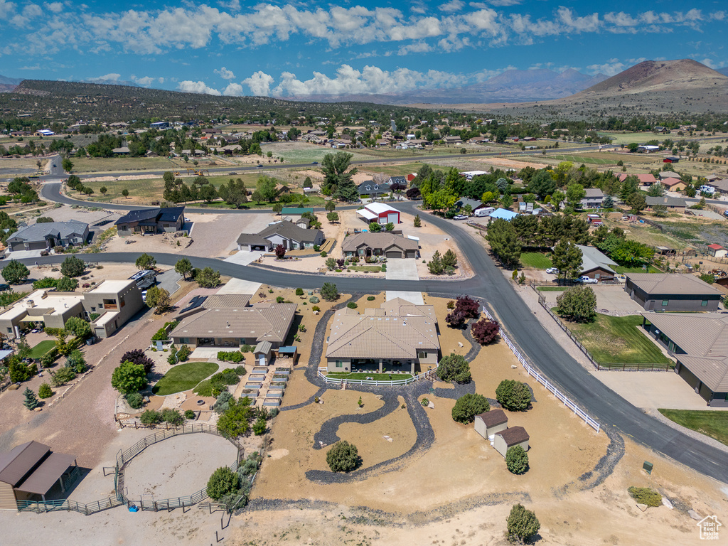Aerial perspective of suburban area featuring a mountain backdrop