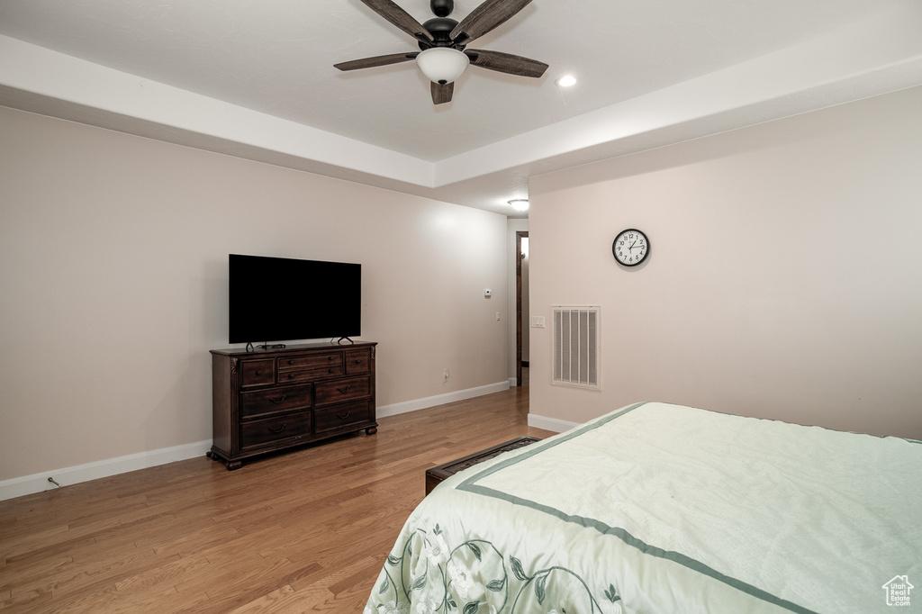 Bedroom featuring baseboards, light wood-style floors, recessed lighting, and a ceiling fan