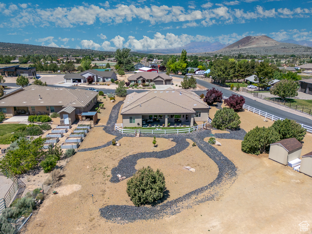 Aerial view of residential area featuring a mountainous background