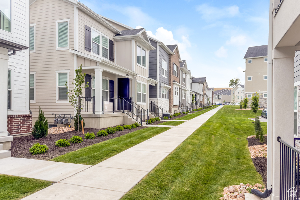 View of community with a residential view and a yard