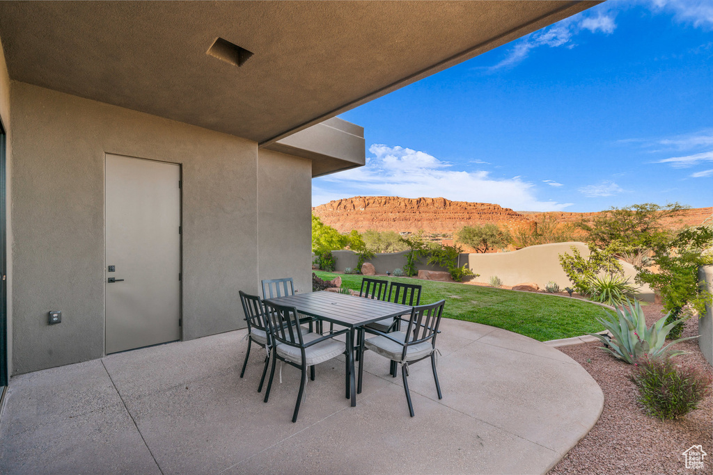 View of patio / terrace with a mountain view and outdoor dining area