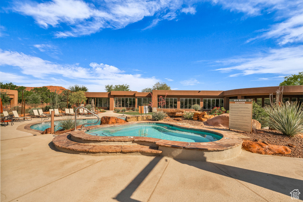 Community pool featuring a patio