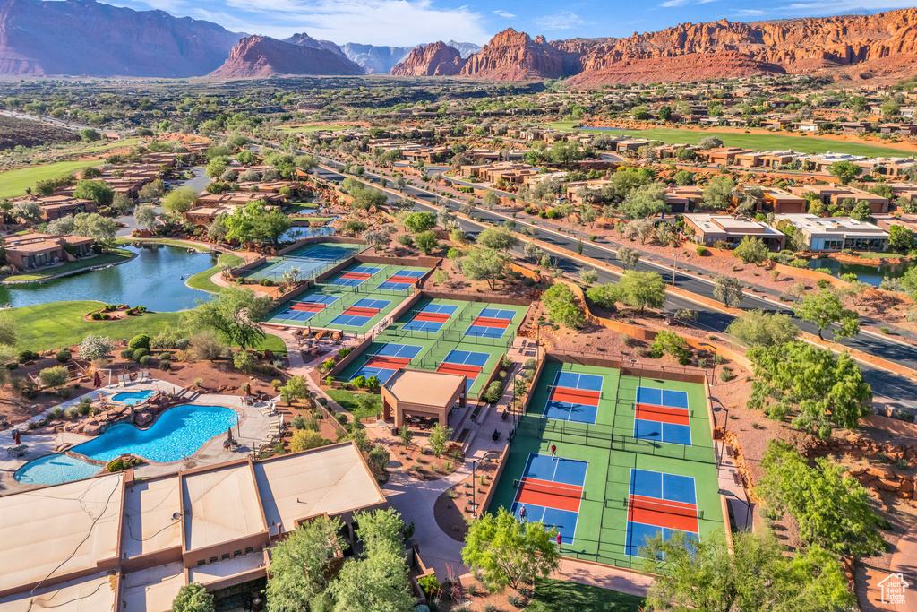 Bird's eye view of a water and mountain view and a pool area