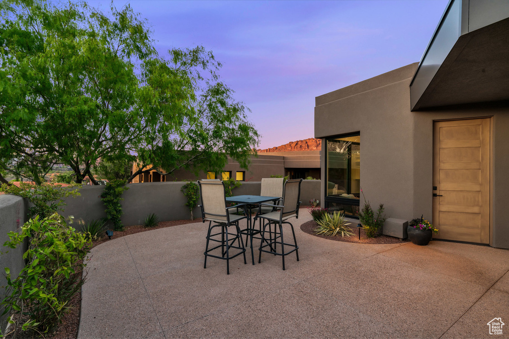 Fenced backyard with a patio and outdoor dining area