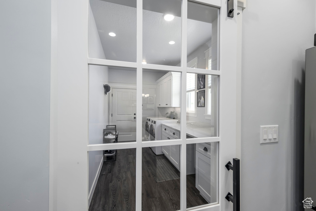 Storage area featuring independent washer and dryer