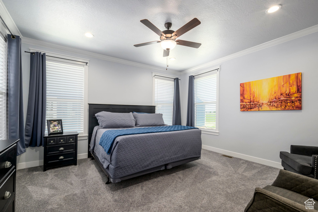 Bedroom featuring crown molding, carpet floors, baseboards, ceiling fan, and recessed lighting