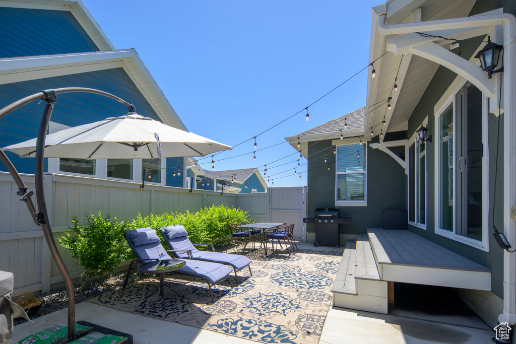Fenced backyard featuring outdoor dining space and a patio area