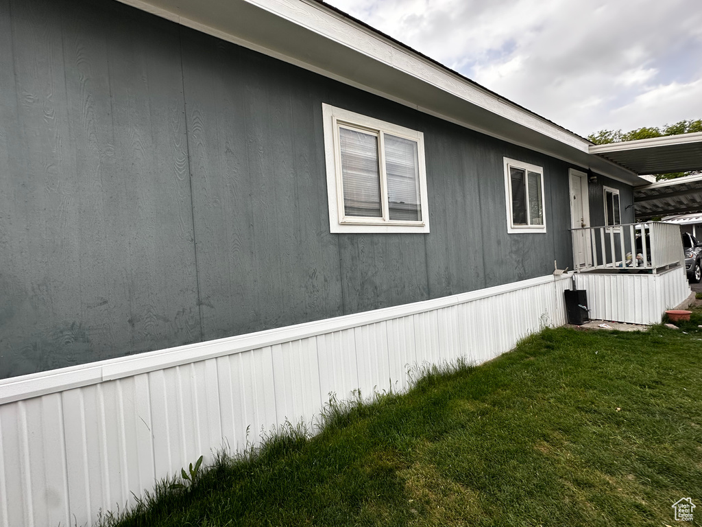 View of home\'s exterior with a yard