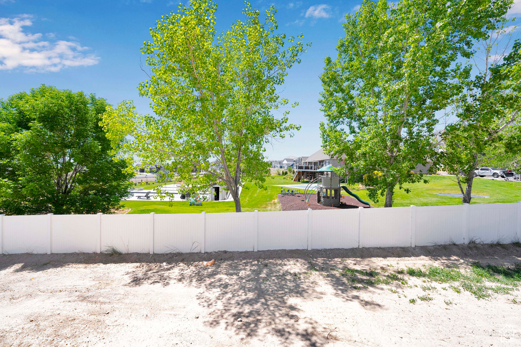 View of yard featuring a playground and a residential view