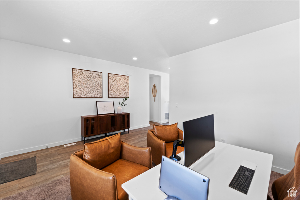 Office with wood finished floors, recessed lighting, and baseboards