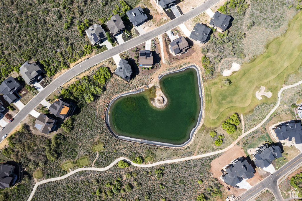 Aerial view of property's location featuring nearby suburban area and a local golf course