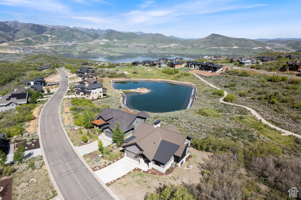 Aerial perspective of suburban area featuring a water and mountain view